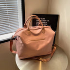 Solenne diaper bag worn as a handbag — NAEVII