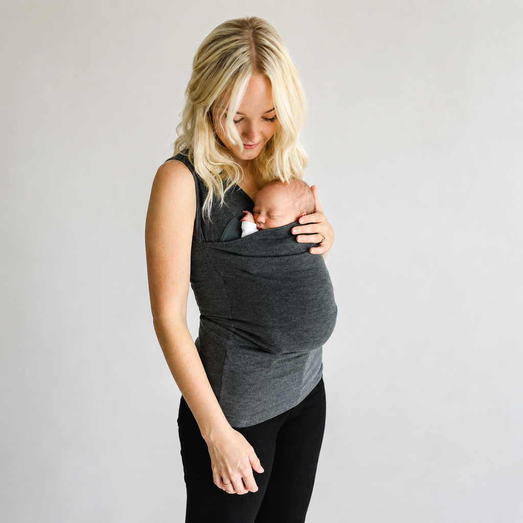 Mom carrying newborn in the Nesting Mom Shirt — NAEVII