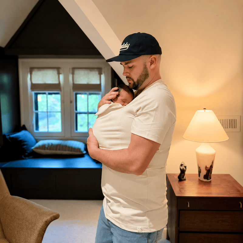 Dad babywearing indoors