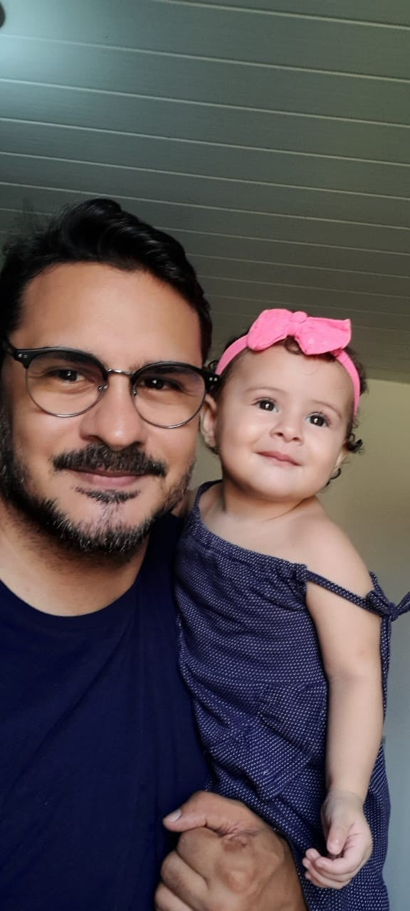 Dad holding baby close